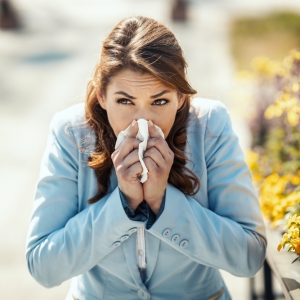 A woman suffers from severe allergy symptoms